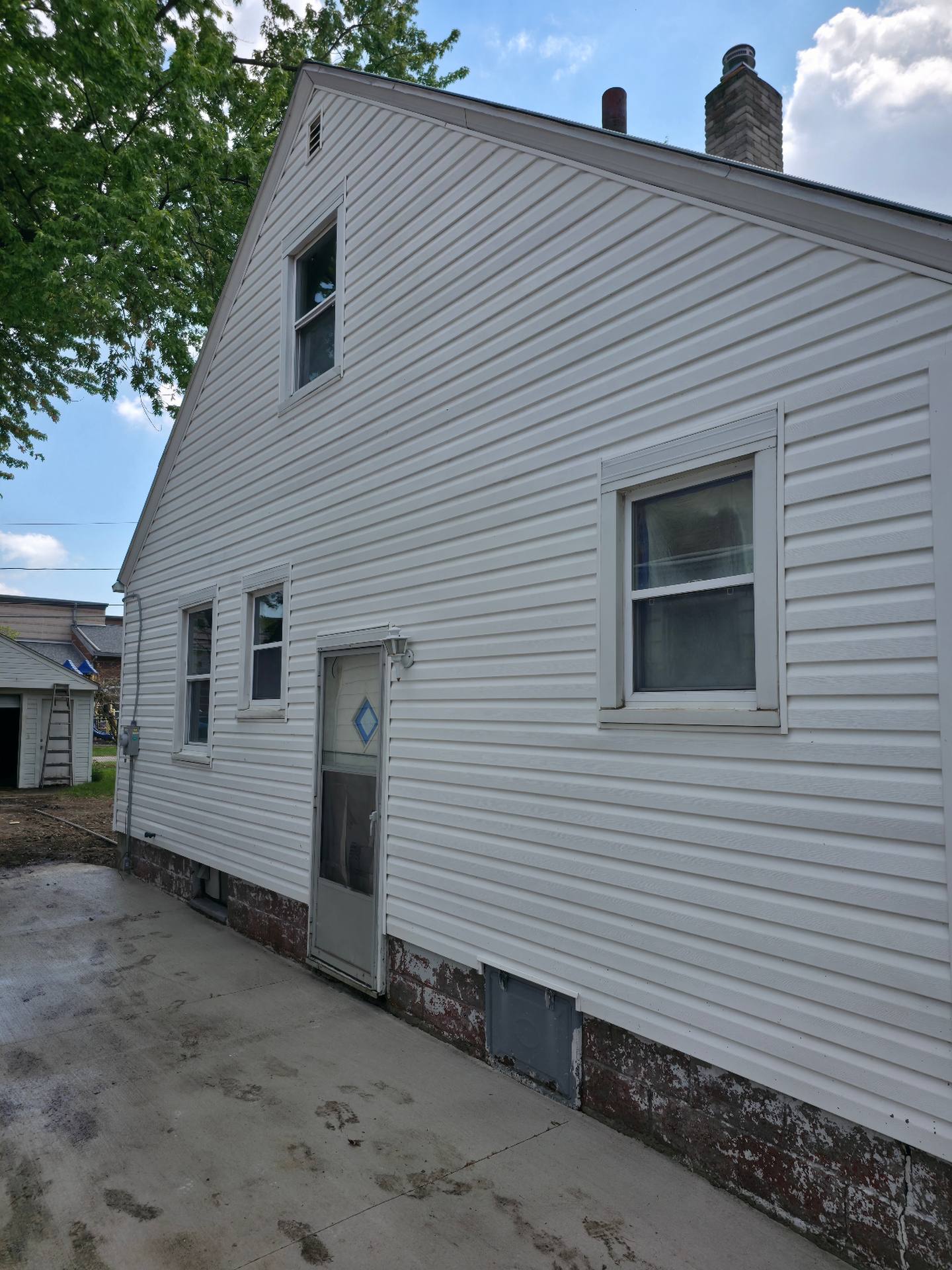 Sylvania home siding after soft wash — bright white siding fully restored